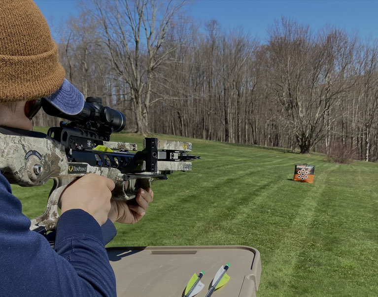 TenPoint Vapor RS470 Crossbow In The Field Pointed At Target - Narrow Photo